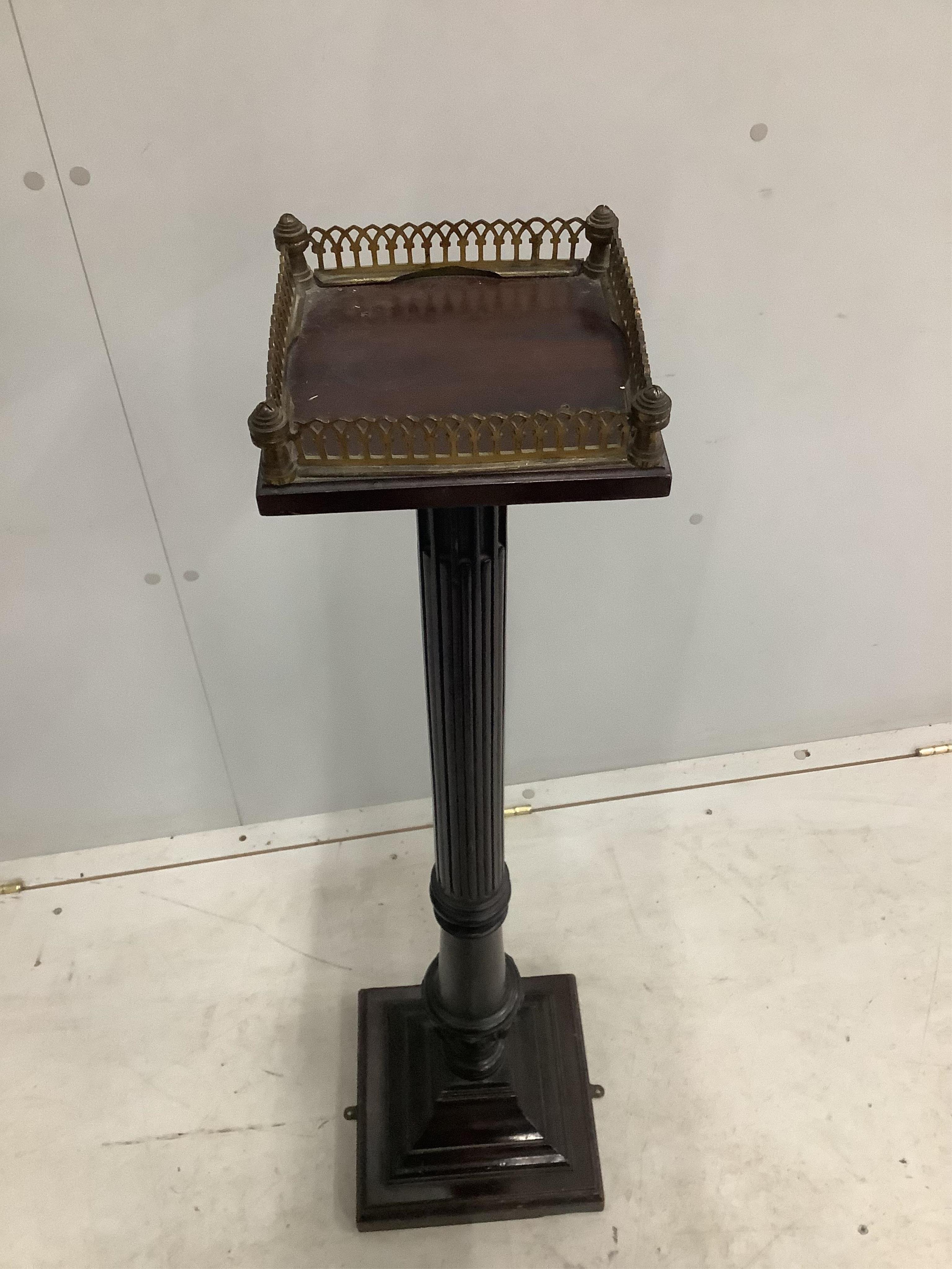 An Edwardian mahogany pedestal with brass galleried top, height 102cm. Condition - fair